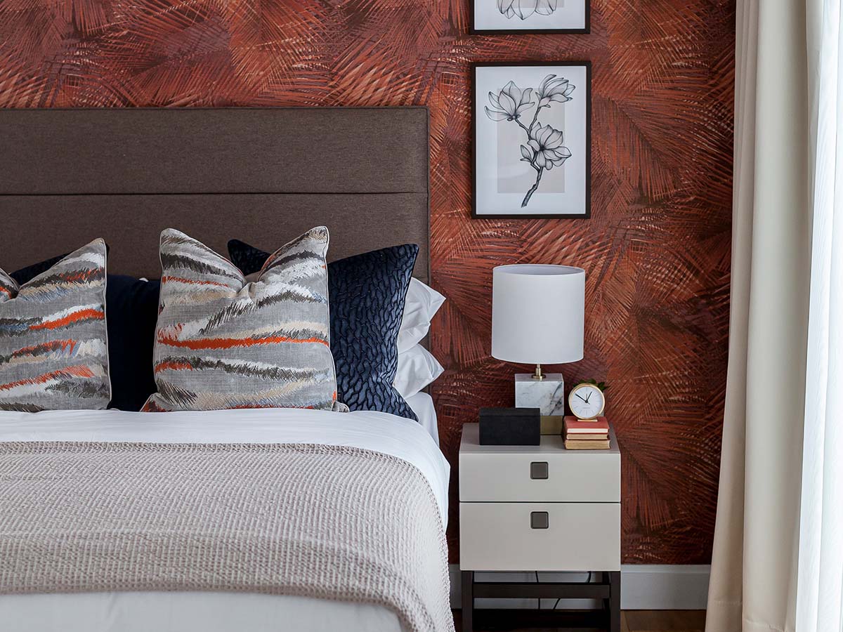 Professionally furnished London flat bedroom with stylish bedding and contemporary art, appealing to overseas investors