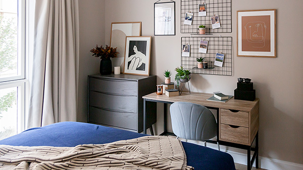Bedroom workspace styled – furnishing package for overseas investors Bedroom workspace styled for rental appeal with desk and wall grid by InStyle Direct London