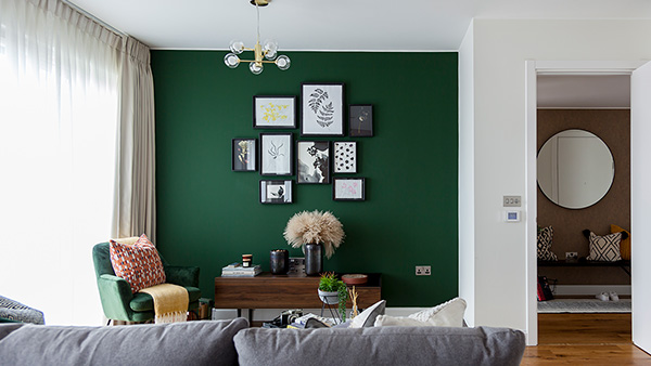 InStyle Direct transformation – London living room with green feature wall Before and after London flat living room, green feature wall and gallery art by InStyle Direct