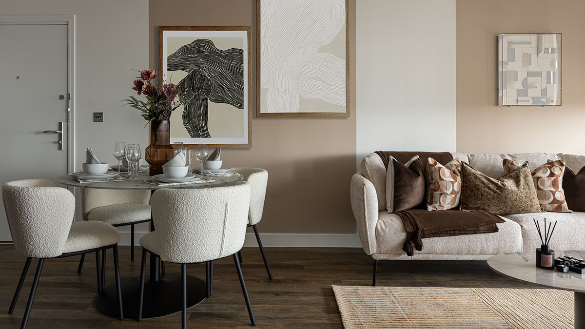 Contemporary living and dining area with neutral furnishings, textured chairs, and soft modern decor