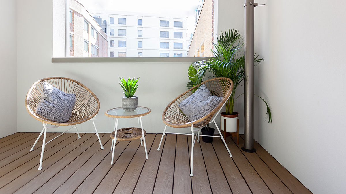 Balcony styled for renters – turnkey outdoor set London balcony staged with rattan chairs and table, turnkey outdoor space by InStyle Direct