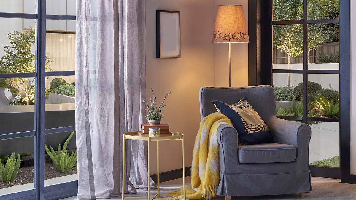 Cozy jewel box room with accent chair and soft lighting