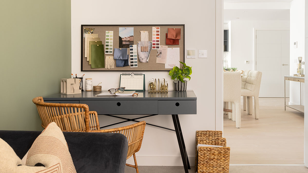 Jewel box room styled home office with desk and mood board
